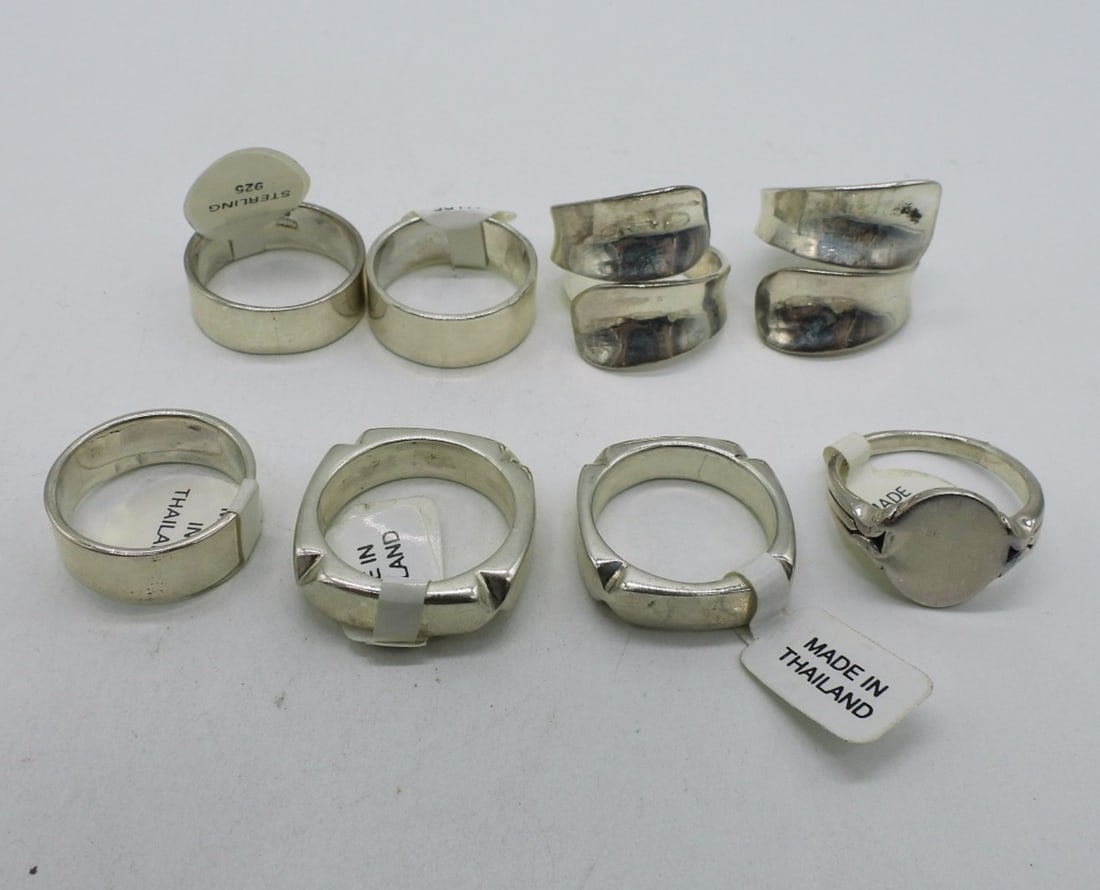8 Brand New Sterling Fashion Rings: Eight new with tag, fashion sterling rings. Sizes 6-8. (30 dwt)