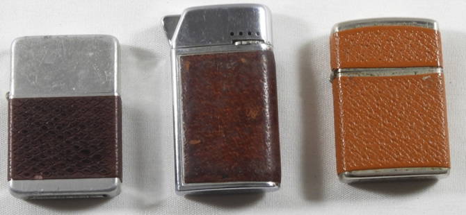 3 Lighters With Faux Leather Exterior: 3 Lighters with a faux leather exterior, untested as to whether they are working or not.