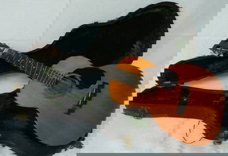 1970 Martin 00 21, Ser# 264409- Moisture Damage: Very nice sounding guitar. Moisture damage to case and guitar finish. Still quality