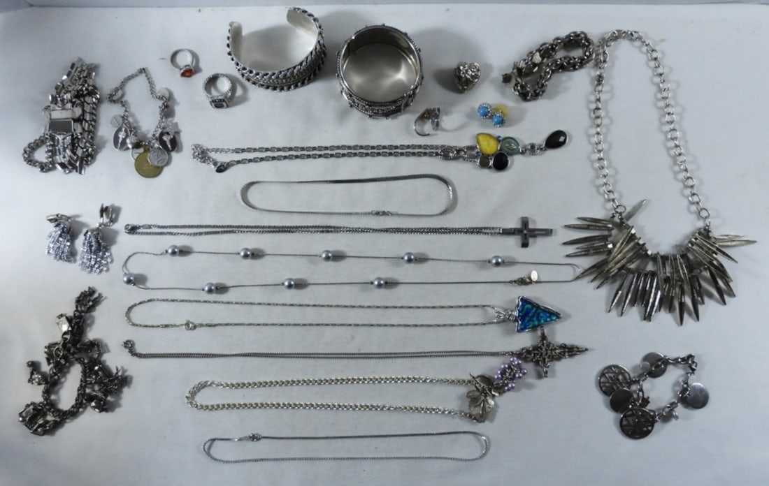 Assorted Silver-Tone Jewelry Lot: Variety of necklaces, bracelets, and more, all silver-toned