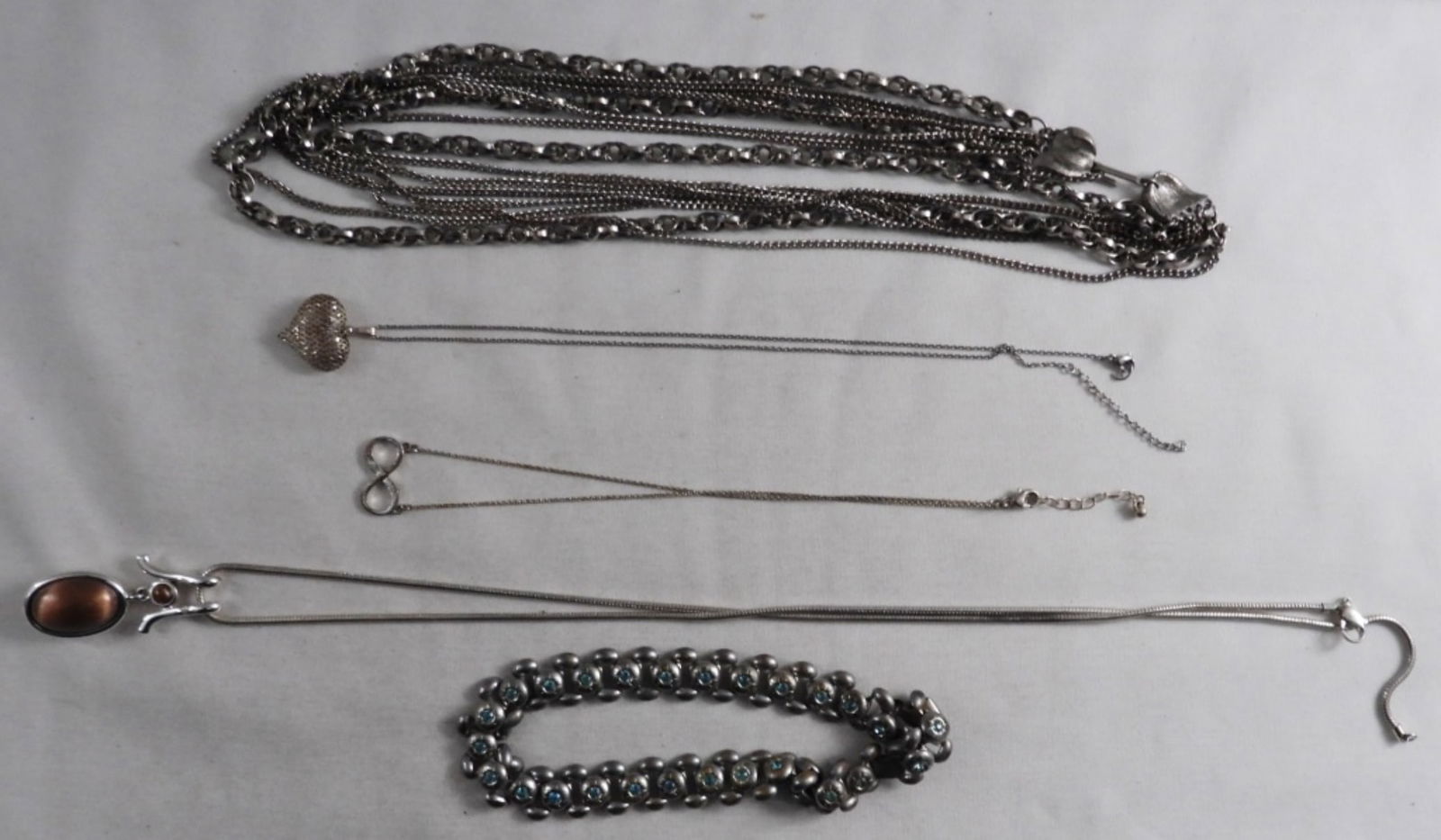 5 Silver-Tone Necklaces: Visit Us On Facebook
