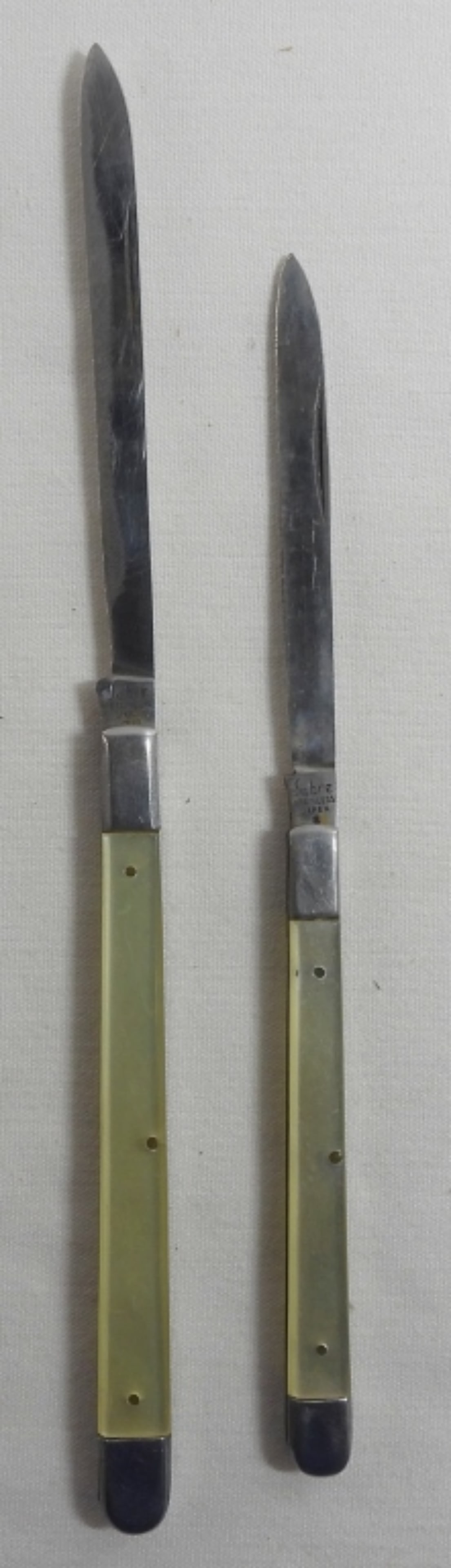 2 Sabre Fruit Knives: 2 folding Sabre fruit knives, total lengths of 7 1/2" and 9 1/4"