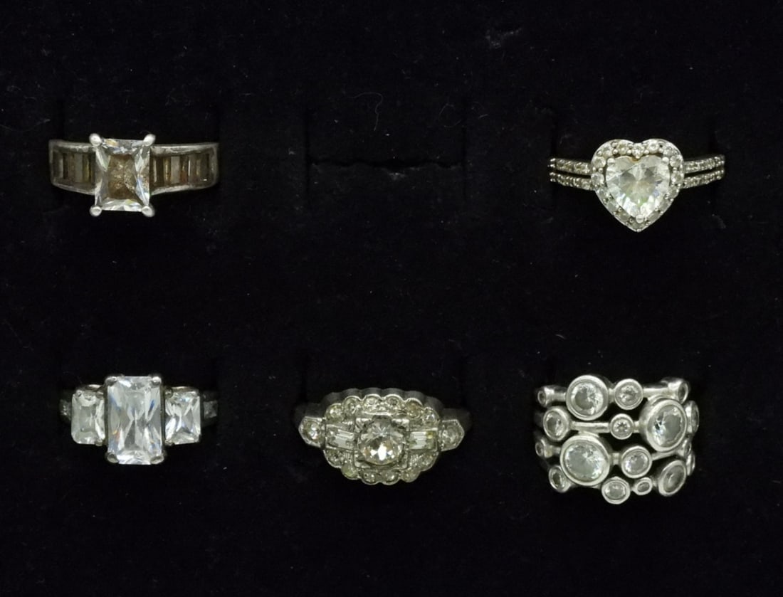 5 Sterling Simulated Diamond Rings: Five sterling simulated diamond rings, sizes 5-9 (15 dwt)