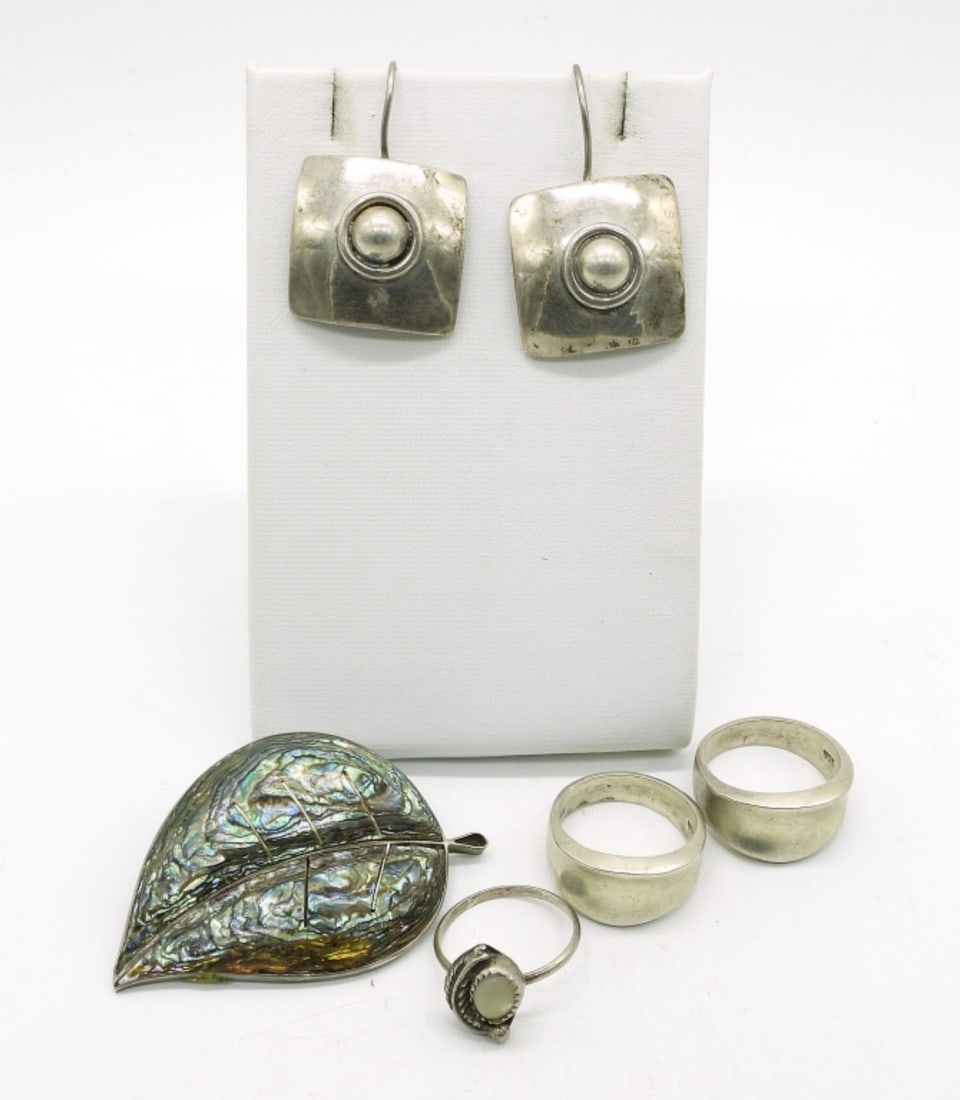 Taxco Abalone 925 Pin & More: Taxco sterling abalone leaf pin, 2". Taxco sterling pierced earrings, 1.5". Three sterling rings, sizes 5.5 & 7. (23.4 dwt)