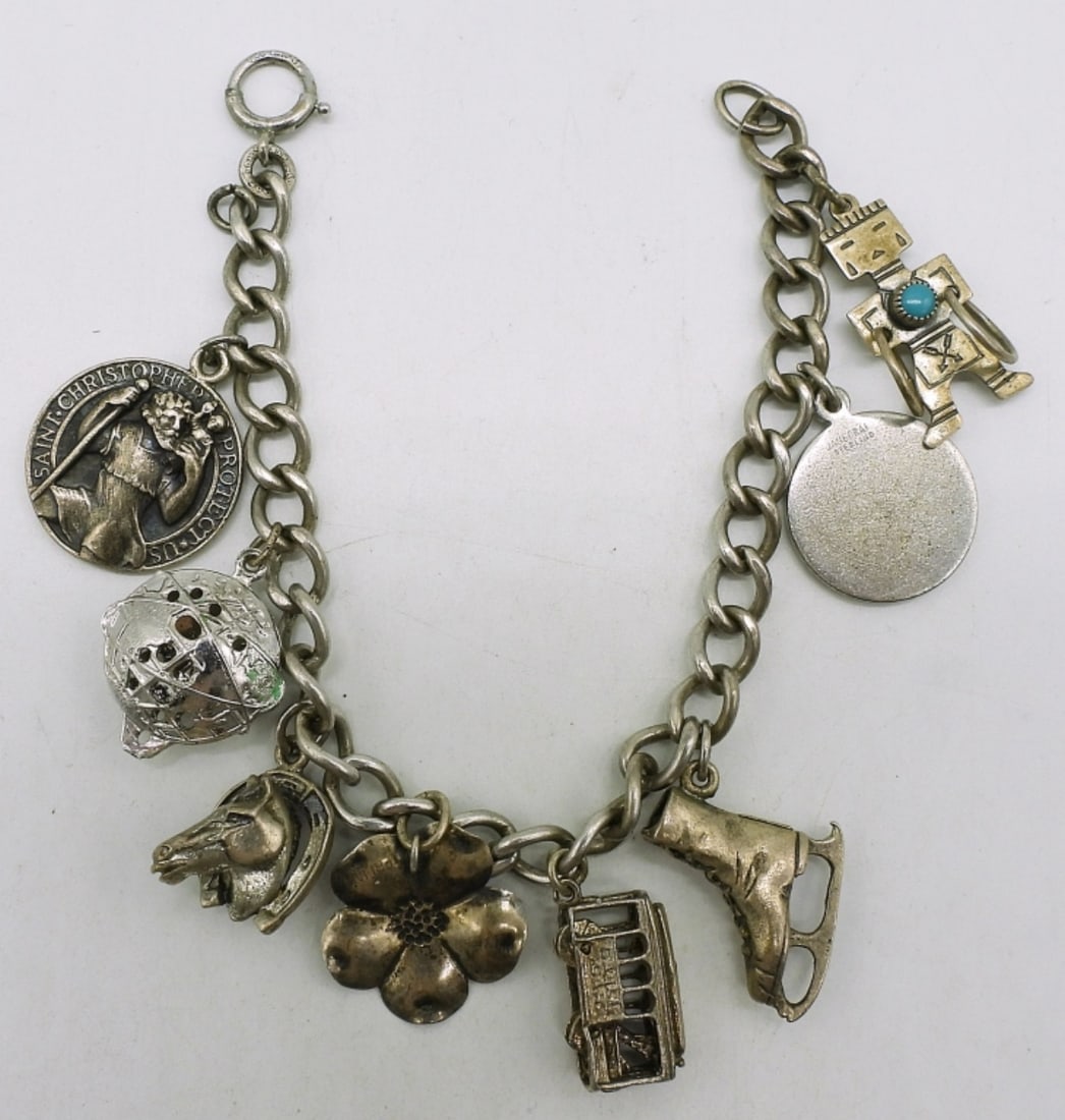 Vintage Sterling Charm Bracelet: Vintage sterling charm bracelet with 8 charms. 7.5". (27 dwt)