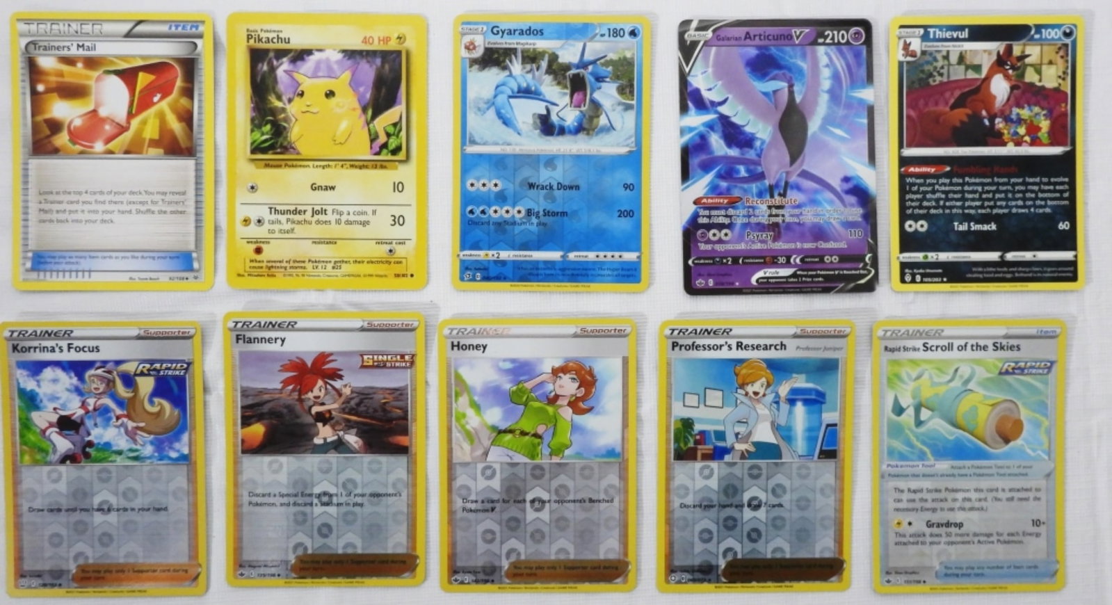 (10) Mixed Lot Of Pokemon Cards: Gyarados 040/192, Pikachu 58/102, Trainer Mail 92/108.