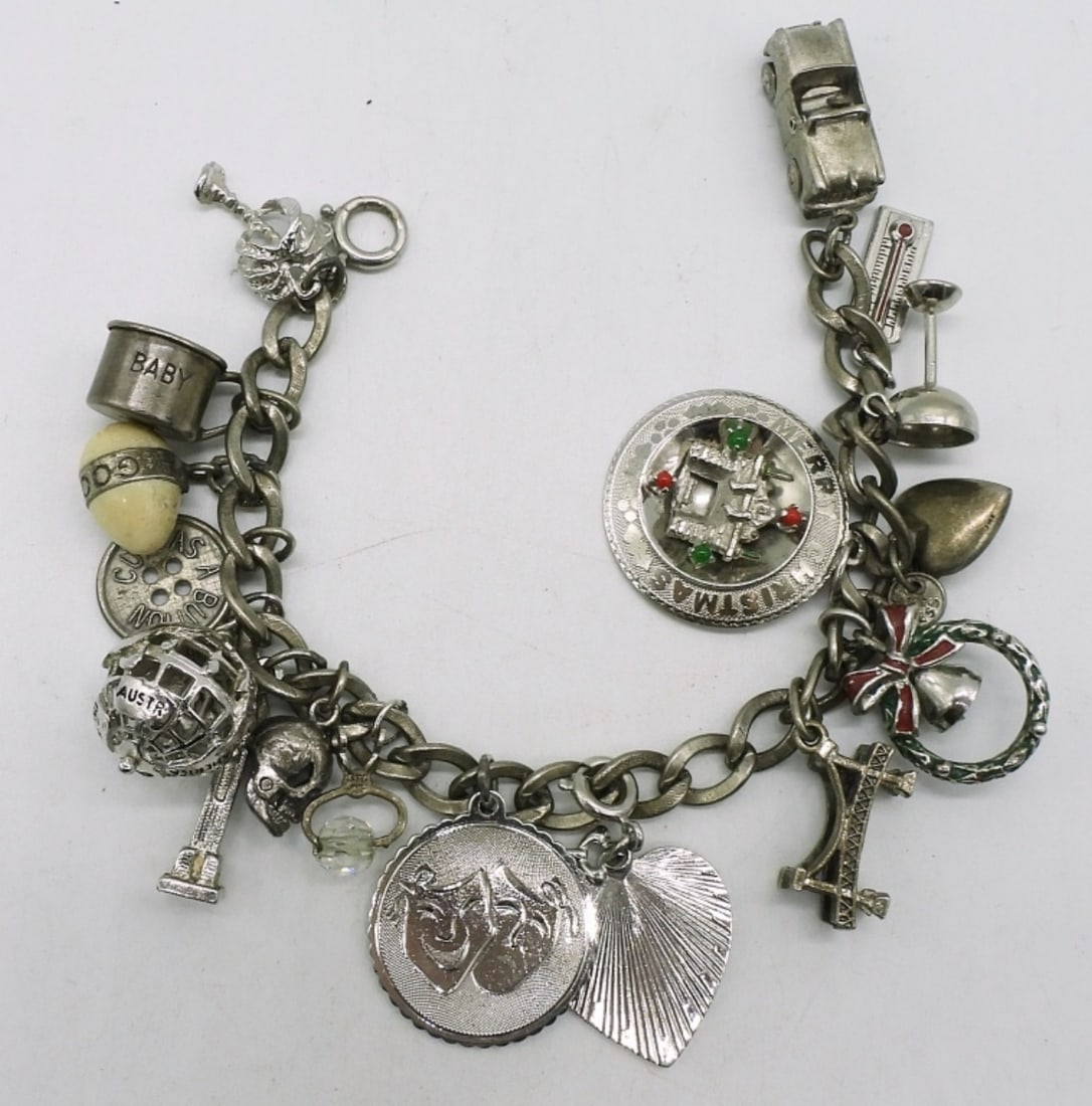 Vintage Sterling Charm Bracelet: Vintage sterling charm bracelet, with 17 Charms. (31.7 dwt)