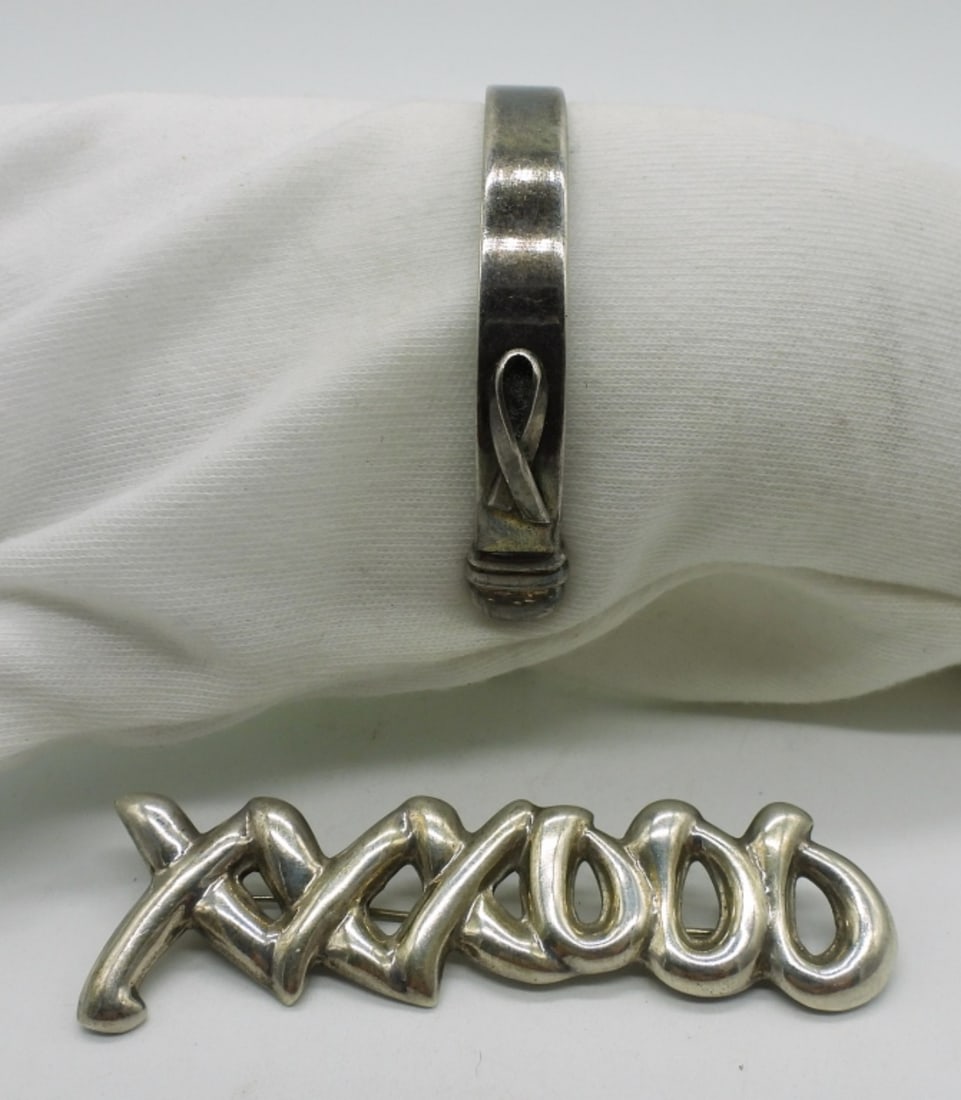 Breast Cancer Sterling Bracelet & More: Sterling cuff bracelet, "until there's a cure" engraved on the inside. Ribbon on the outside. XO sterling brooch, 3". (22.5 dwt)