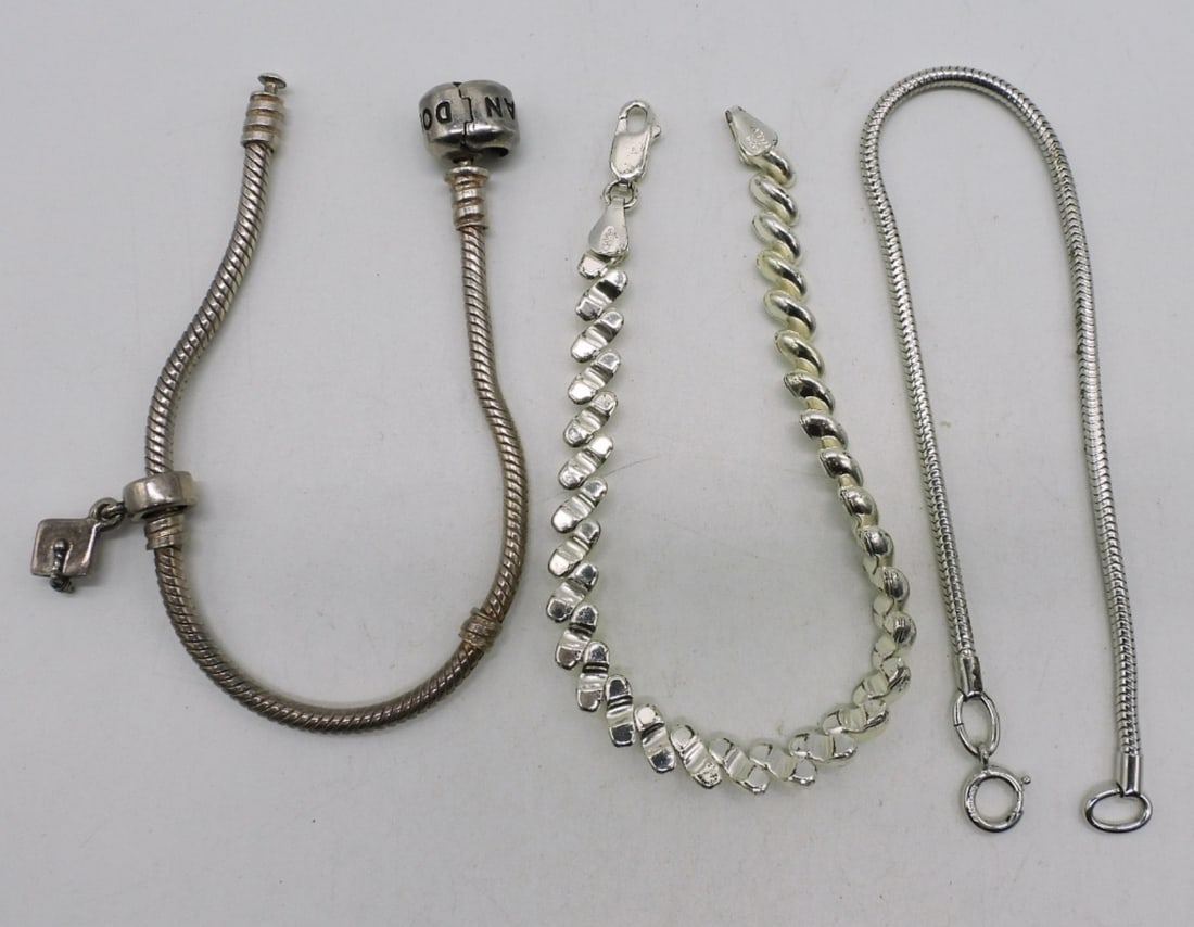 3 Sterling Bracelets - One is Pandora: Three sterling bracelets, one is pandora with one charm. 7-7.5". (17.6 dwt)