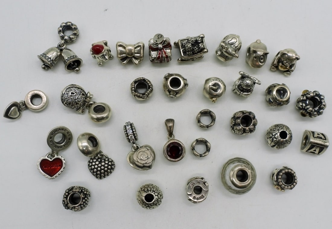 30 Sterling Pandora Style Charms: 30 sterling charms, will fit Pandora charm bracelets. (70 dwt)