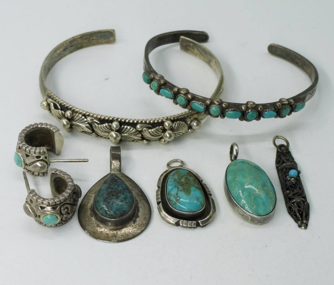 Vintage Turquoise Pendants & Cuffs: Four sterling vintage turquoise pendants, 1" - 1.5". One pair pierced earrings. Two sterling cuff bracelets, one with turquoise. (29.1 dwt)