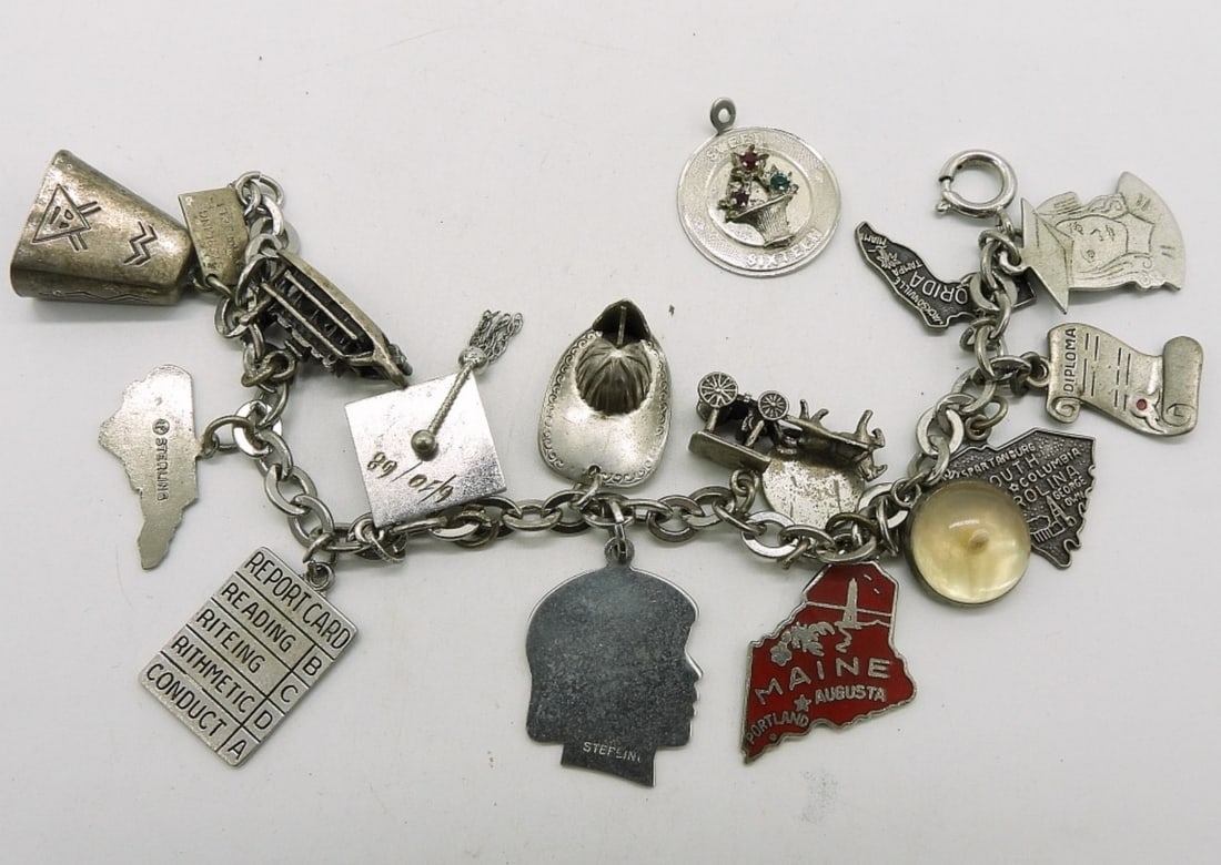 Vintage Sterling Charm Bracelet - 16 Charms: Vintage sterling charm bracelet with 16 charms. 7" long. (25 dwt)