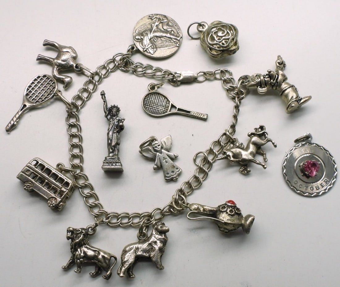 Vintage Sterling Charm Bracelet - 14 Charms: Vintage sterling charm bracelet with 14 charms, 7" long. (27.2 dwt) 6x4x2