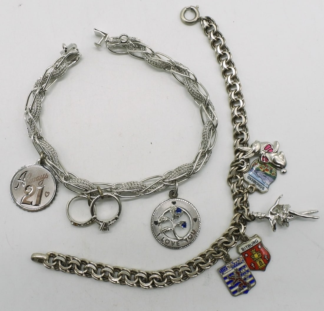 2 Vintage Sterling Charm Bracelets: Two vintage sterling charm bracelets, 7.5" long. Eight charms. (21 dwt)