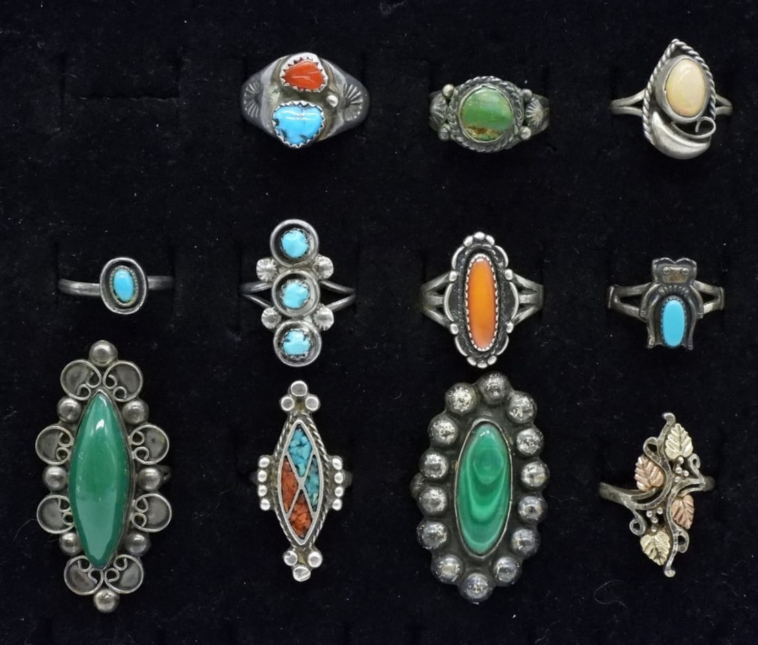 11 Sterling Turquoise, Opal Rings & More: Eleven vintage sterling rings. Sizes 4 - 9. Turquoise, Malachite, Opal, Red Coral & More. Some rings need minor welding repair. Some bands are misshapen. (30 dwt)