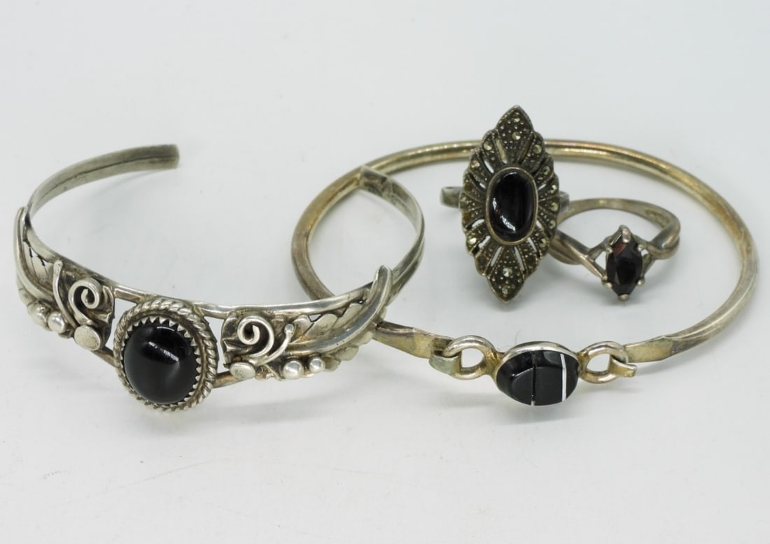Black Onyx 925 Bracelets & Rings: Two sterling bracelets with black onyx gemstones, cuff and bangle. Two rings, size 6. (18.3 dwt)