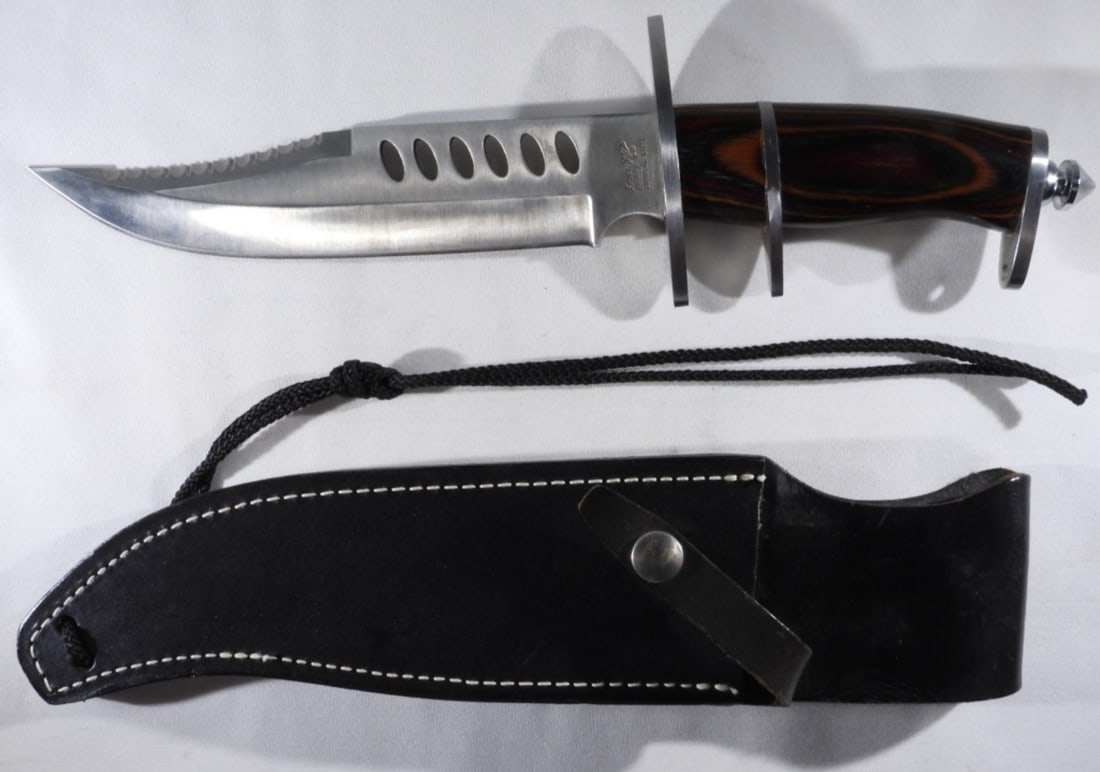 Frost Cutlery Crocodile Bowie II Fixed Blade: Taiwan 7 7/8' Blade and 13" length. Comes with a black leather sheath that is not form-fitting