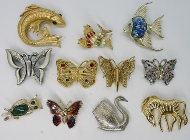 (11) Brooches