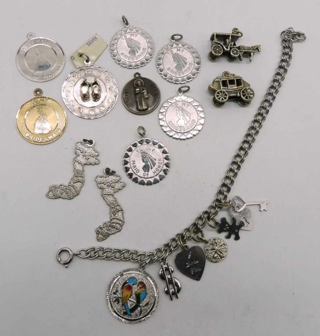 Vintage Sterling Charm Bracelet & Charms: Vintage sterling charm bracelet, 7" long. 18 Charms. (34.6 dwt) (6x4x2)