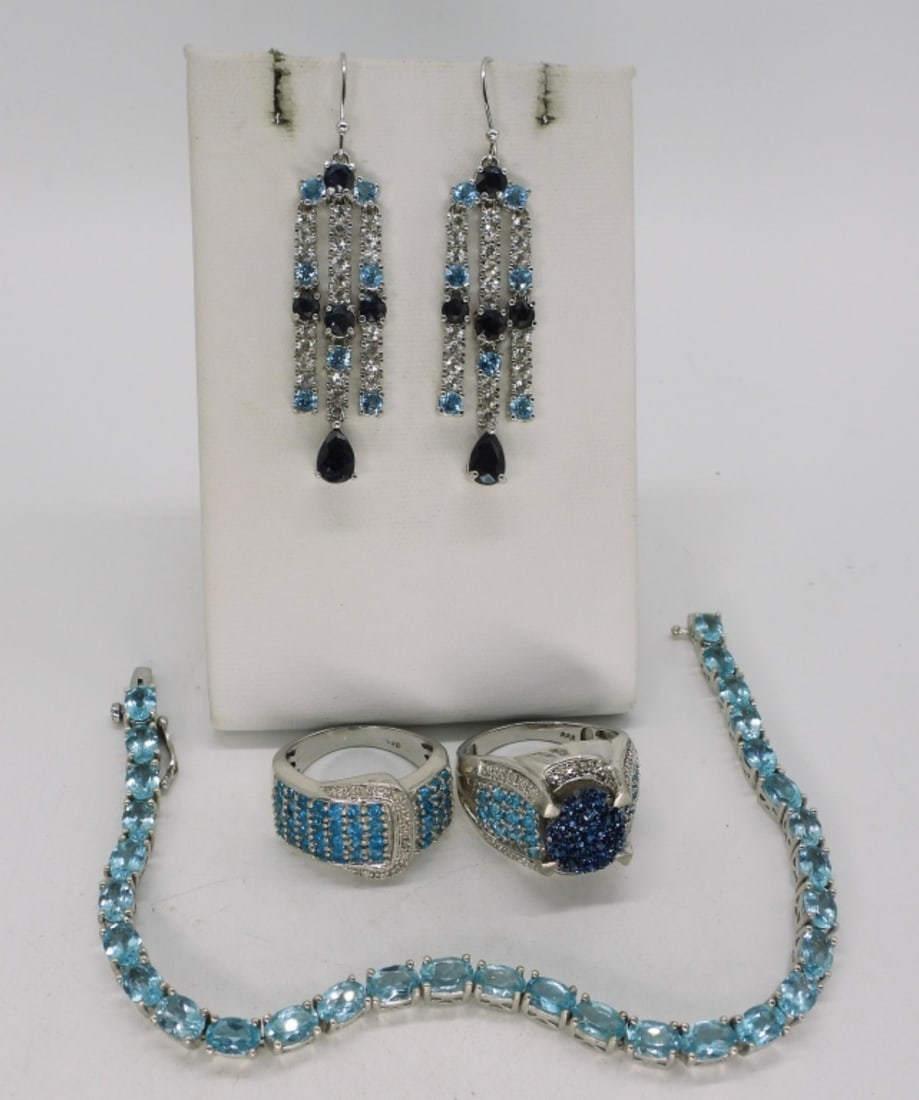 Blue Topaz Sterling Rings, Earrings & More: Blue topaz sterling. Two rings, sizes 8 & 9. One pair of earrings, 2". Bracelet is 7.5". (23.7 dwt) (6x4x2)