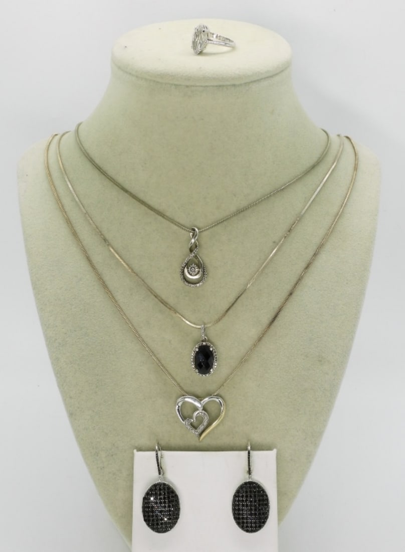 Black Spinel & Simulated Diamond Pieces: Black spinel 925 pierced earrings, 1.5" long. Simulated Diamond 925 ring, size 4. Three sterling necklaces, 16"-20" long sterling chains. (17 dwt) (6x4x2)