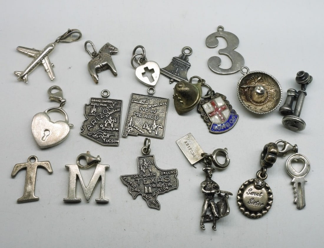17 Sterling Vintage & Modern Charms: Seventeen sterling charms. Vintage and Modern. (25 dwt) (6x4x2)