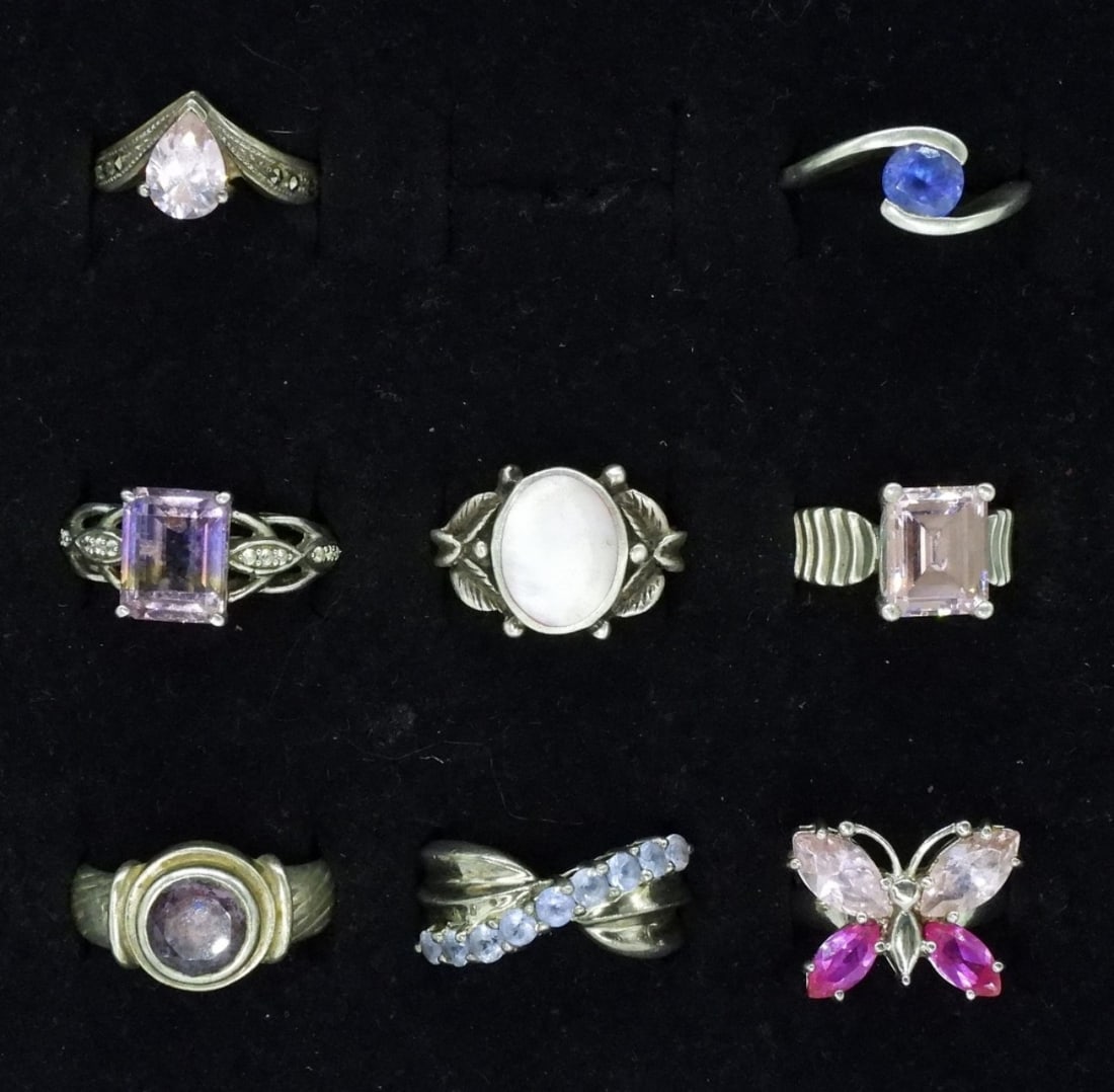 8 Sterling Pink & Purple Gemstone Rings: Eight sterling rings with pink and purple gemstones. Sizes 5.5 - 8 (24 dwt) (6x4x2)
