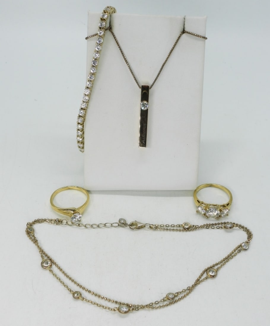 Gold Tone 925 Rings, Bracelets & Necklace: Necklace is a gold tone sterling with a moissanite gemstone and "Autumn" engraved. On a gold tone 18" chain. Bracelets are 7" and 10". Two rings, size 7. (16.6 dwt) (6x4x2)