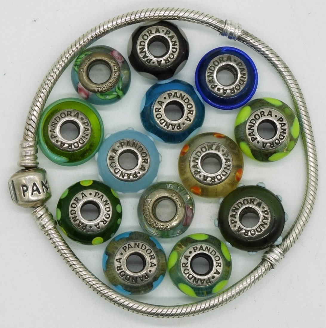 Pandora 925 Bracelet & 13 Pandora Charms: One sterling Pandora bracelet with 13 glass & sterling Pandora brand beads. (23 dwt) (6x4x2)