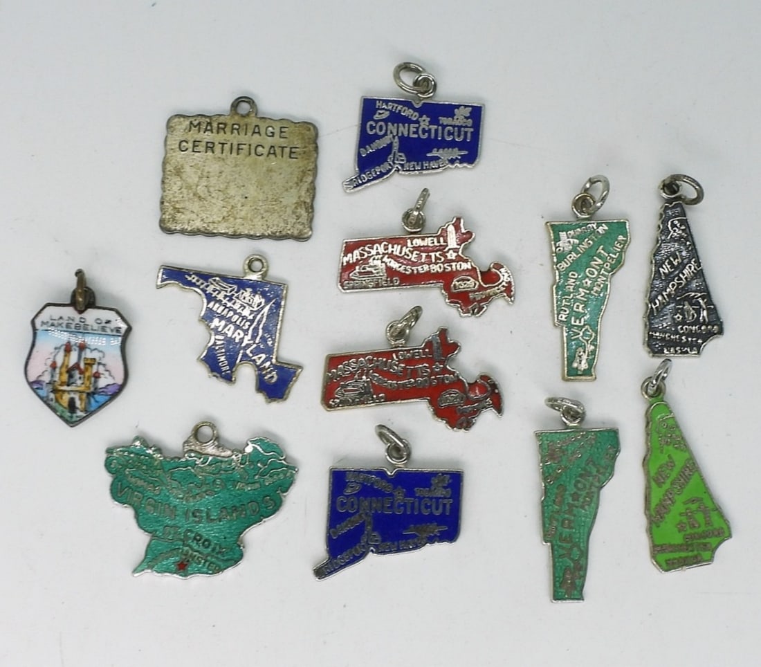 12 Vintage Sterling Charms: Twelve vintage sterling charms. 1" or smaller. (11.5 dwt) (6x4x2)