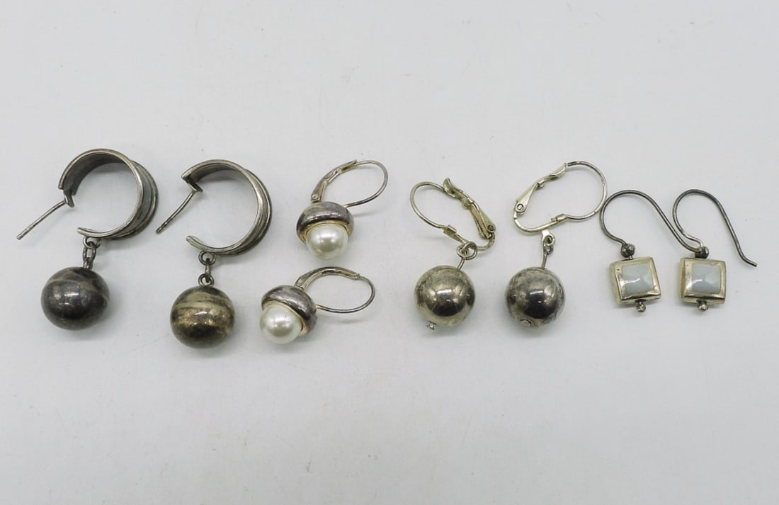 4 Pair of Pierced Sterling Earrings: Four pair of pierced sterling earrings. (12.6 dwt)