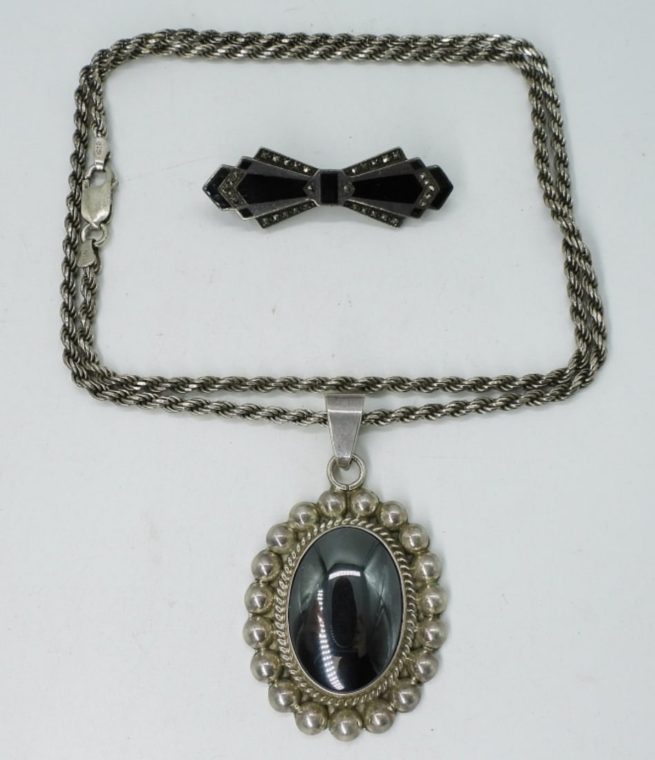 Large Hematite 925 Pendant & Art Deco Pin: Large pendant with beautiful hematite gemstone, 2". Sterling chain is 24". Vintage sterling art deco, black onyx pin, 2". (27 dwt)