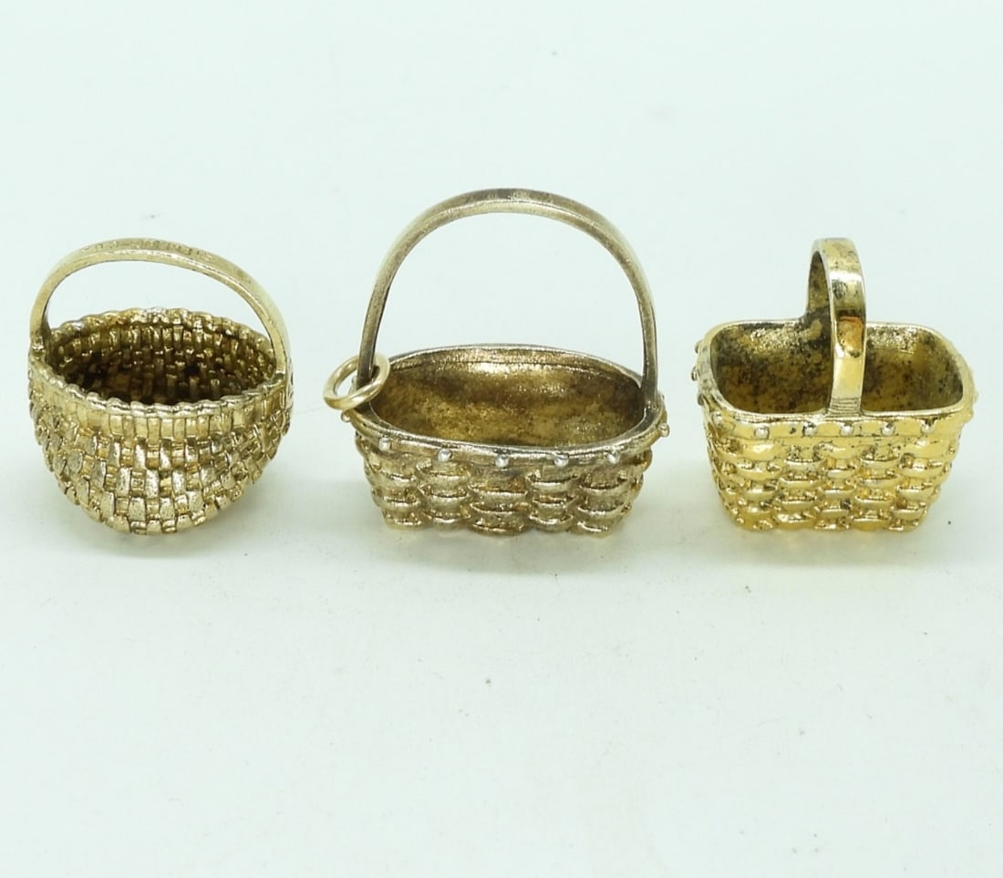 3 Sterling Gold Tone Tiny Baskets: Three sterling, gold tone tiny baskets. Possibly pendants. 1" and under. (13.1 dwt) (6x4x2)