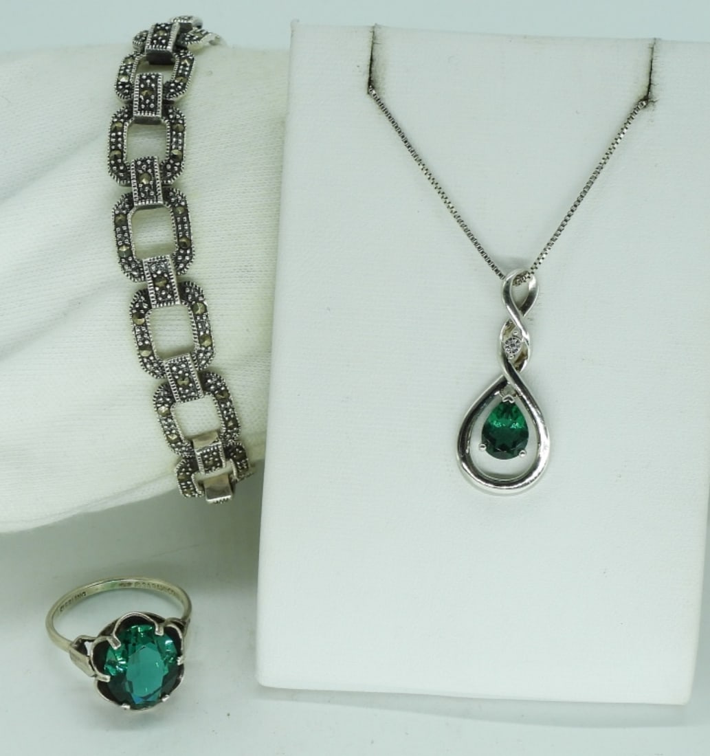 Simulated Emerald 925 Ring, Necklace & More: Simulated emerald necklace, 18" long. Vintage sterling simulated emerald ring, size 8. Sterling marcasite bracelet, 7.5" long. (18 dwt) (6x4x2)