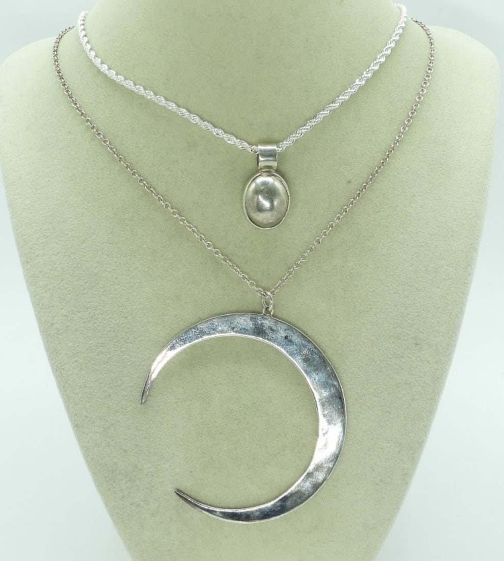 RLM Crescent Moon & Mexico Necklace: RLM Studios crescent moon pendant, 3" long. On a 18" long chain. Mexico sterling oval pendant, 1" long on a sterling 16" chain. (18.4 dwt) (6x4x2)