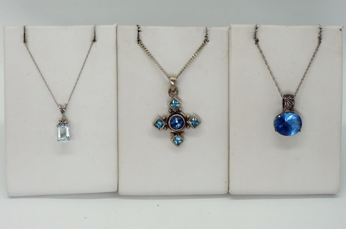 Blue Topaz & Aquamarine Sterling Necklaces: Three sterling necklaces, 18-20" long. Two with blue topaz gemstones, one with aquamarine. (10 dwt) (6x4x2)