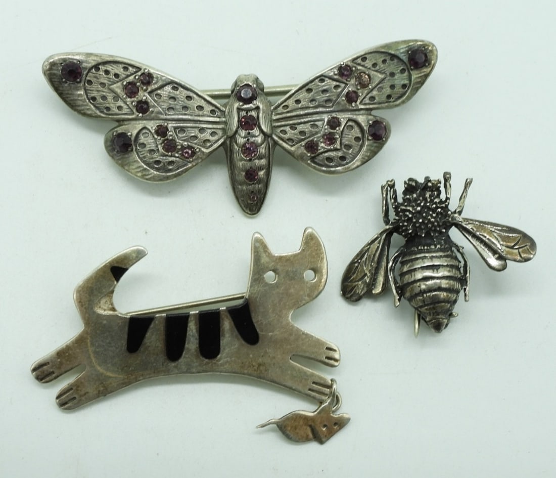 3 Sterling Animal Brooches: Three sterling animal brooches. Cat is marked "TM-136 Anne Harvey Mexico 925". Bee and Moth marked 925. 1"-2.5" (17.3 dwt) (6x4x2)