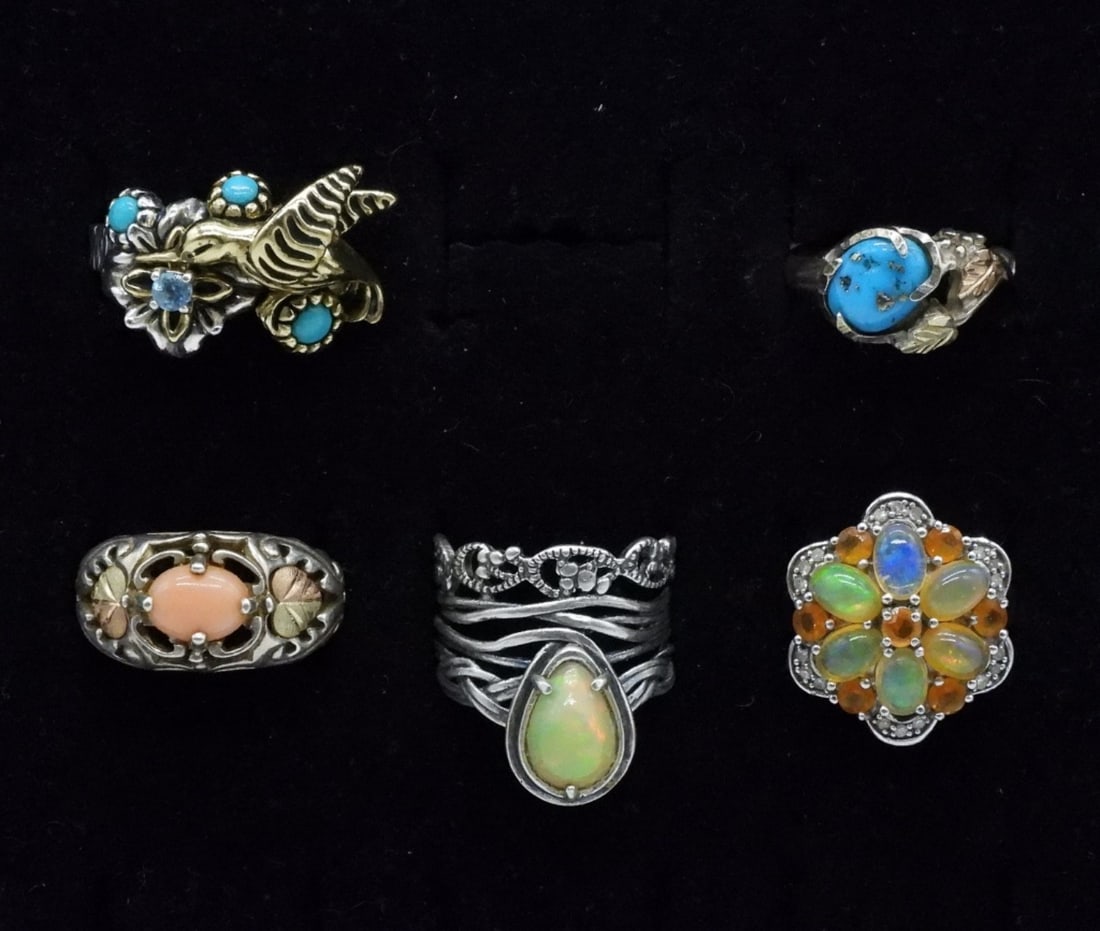 Carolyn Pollack & Fun Gemstone 925 Rings: One Sterling Carolyn Pollack ring, Hummingbird with turquoise & blue topaz gemstones, size 7. Four other sterling rings with cute designs and gemstones, sizes 6 & 7. (16 dwt) (6x4x2)