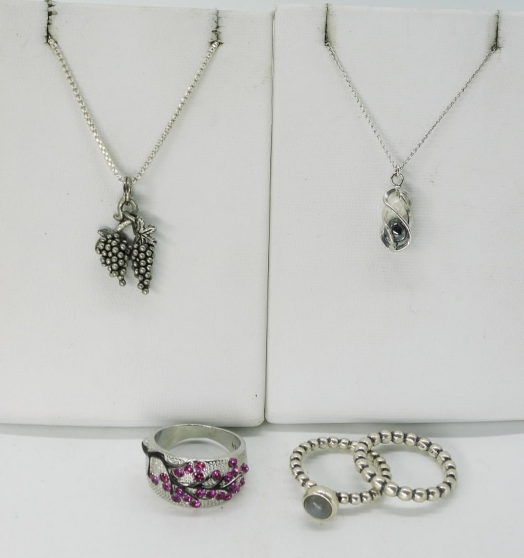 Petite Sterling Necklaces & 3 Rings: Two sterling necklaces with petite pendants, on 18" sterling chains. Three sterling rings, sizes 5 & 6. (12.2 dwt) (6x4x2)