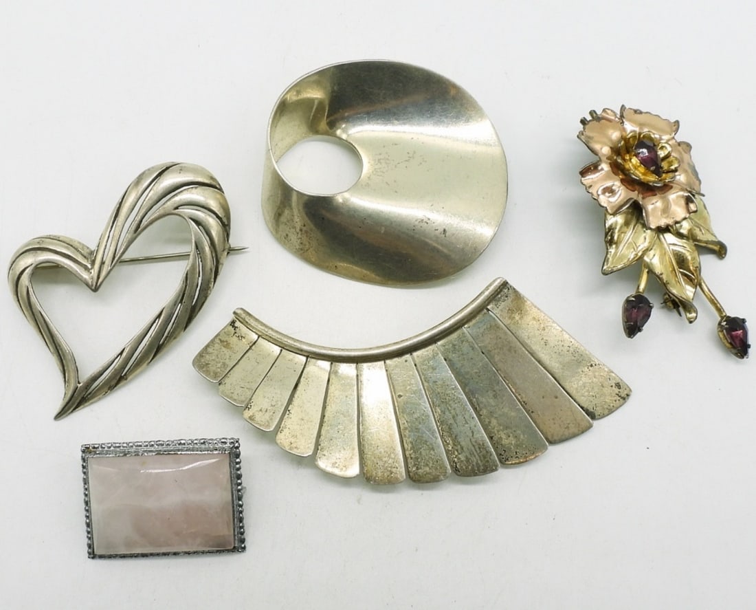 Taxco, Rose Quartz & More 925 Brooches: Two sterling Taxco brooches. TC-125 & TS-76. 2" - 3". Rose Quartz brooch, vintage gold filled floral brooch and a heart brooch. 1" - 3". (37 dwt)