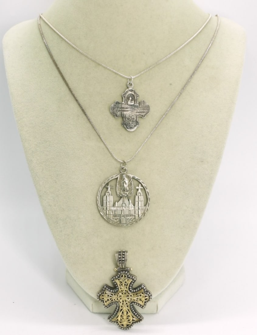 Religious 925 Necklaces & Pendants: Three sterling religious pendants, 1" - 2". Two sterling chains, 30". (37 dwt)