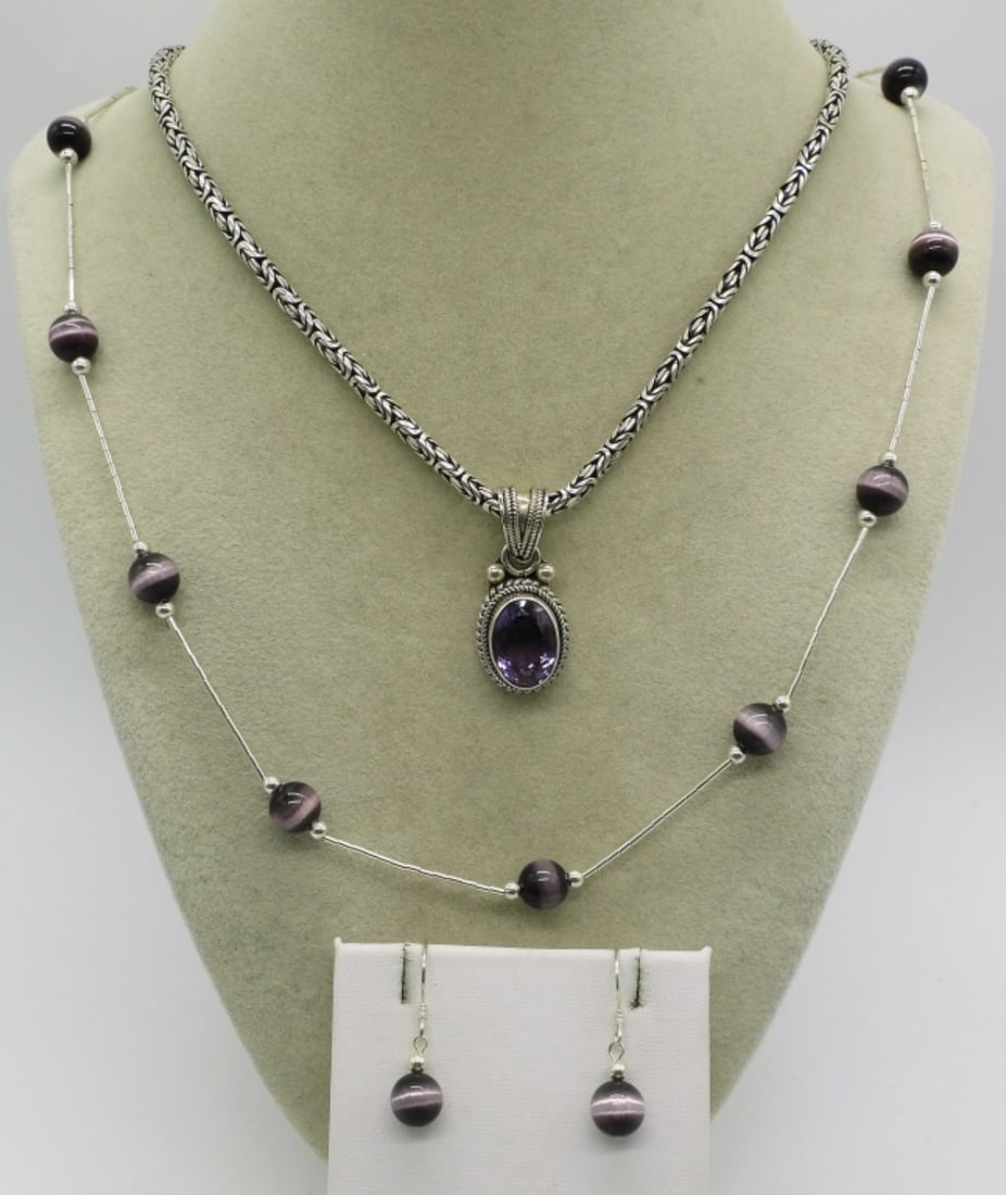 Amethyst, Cats Eye, Liquid Sterling Jewelry: Amethyst pendant on a thick 20" sterling chain. Purple cats eye beads on a liquid sterling 24" chain with matching pierced earrings (1" long). (27 dwt) (6x4x2)