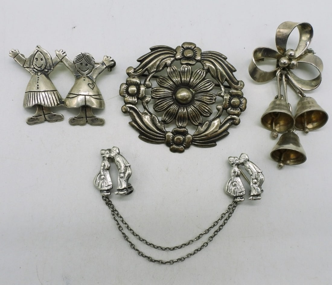 Danecraft, Taxco & More 925 Brooches: Danecraft floral brooch 2". Taxco bow and bells brooch, 2". Two other sterling pins. (23.9 dwt)
