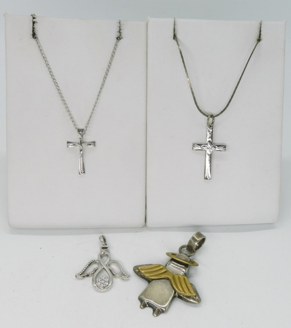 Diamond Angel Pendant & More Religious 925: Diamond sterling angel pendant, 1" long. Three other sterling pendants, 3/4" - 2". Two sterling chains, 16" & 18". (7.5 dwt)