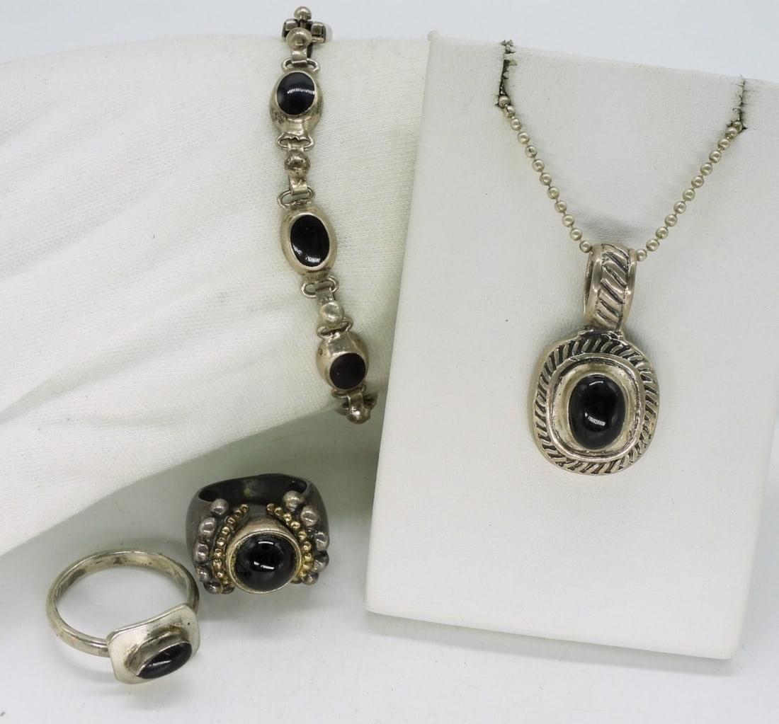 Black Onyx Sterling Set with Rings: Two sterling black onyx rings, size 6 & 10. Sterling black onyx bracelet 7" and necklace 20". (30 dwt)