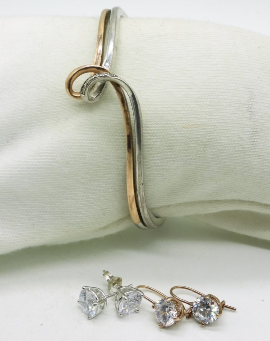 Sterling & 10K Bracelet & Earrings: Hinged cuff bracelet, sterling and 10k gold accent / overlay. A few tiny diamonds. Two pair of sterling simulated diamond earrings. (13 dwt) (6x4x2)