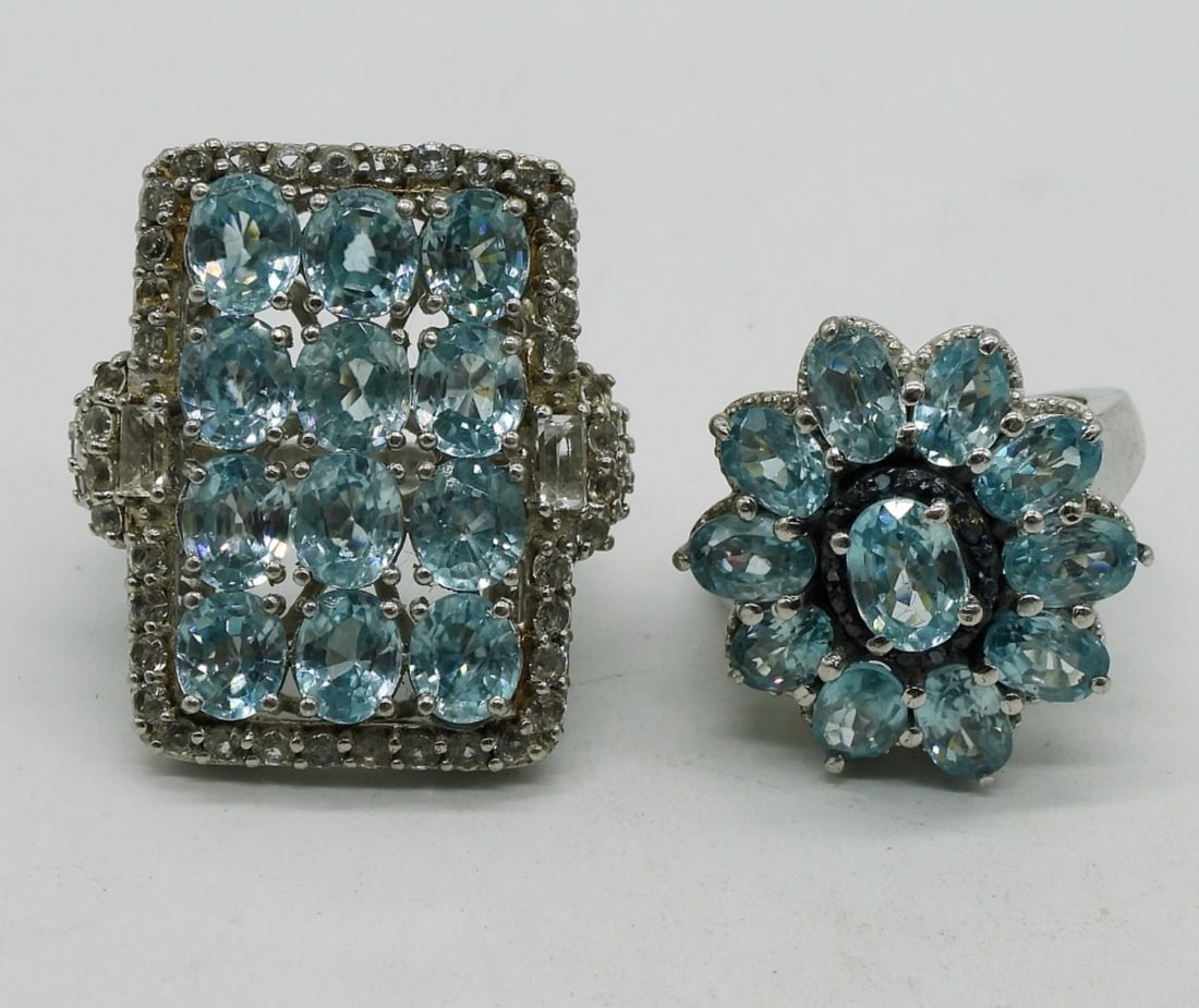 2 Blue Topaz Sterling Fashion Rings: Two sterling fashion rings with blue topaz gemstones. Sizes 7 & 8. (12.7 dwt) (6x4x2)