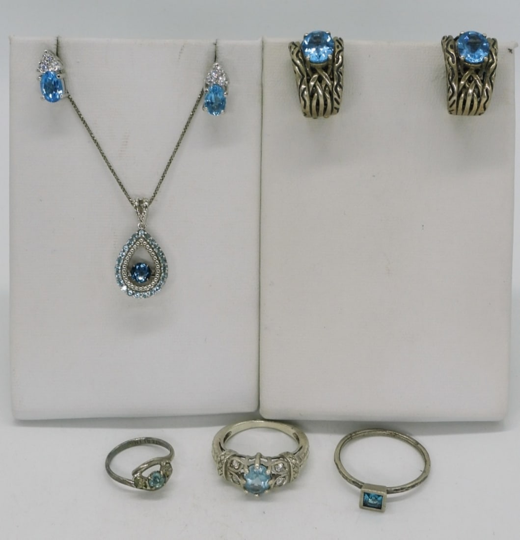 Blue Topaz 925 Rings, Earrings & Necklace: Blue topaz sterling rings, earrings and necklace. Necklace is 18" long. Two pair of pierced earrings. Three rings with blue topaz gemstones. Sizes 3, 7, 9.5. (14 dwt) (6x4x2)