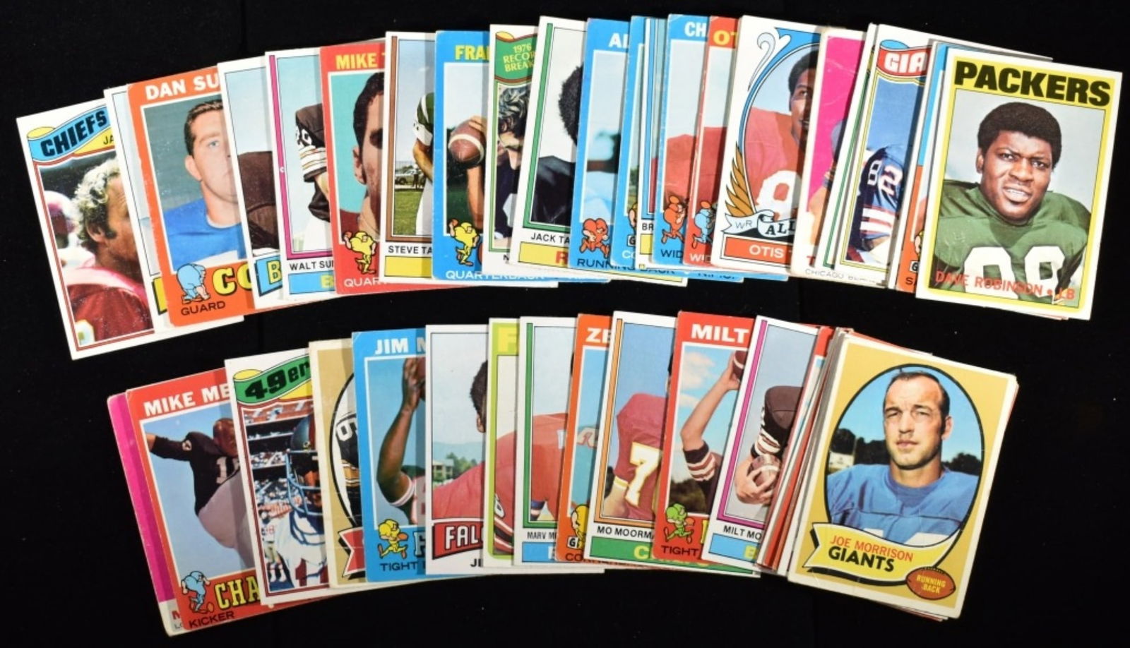 Medium Mixed Lot Of Football Cards: Johnny Robinson, Dave Robinson, and Ken Riley. Conditions may vary. May have duplicates or reprints.