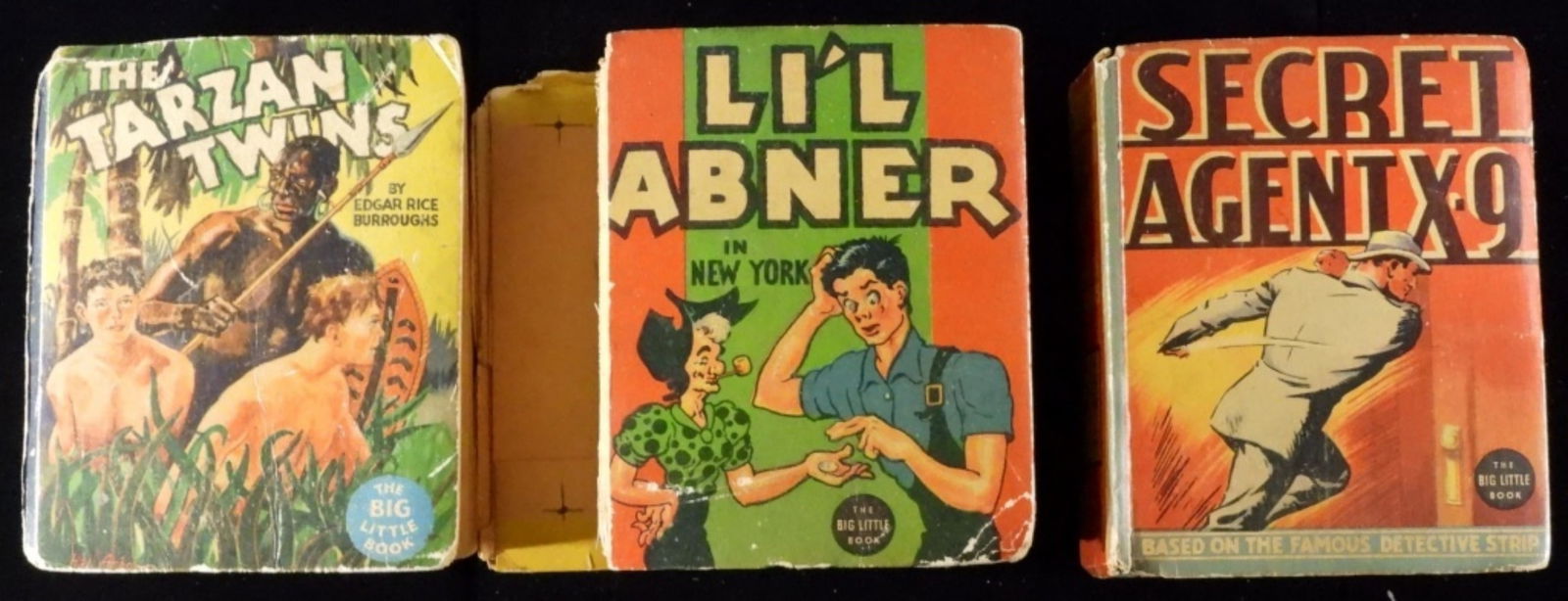 (3) Lot Of The Big Little Books Fair-VG: 1) Secret Agent X-9. 2) Li'l Abner (The front cover is ripped off.) 3) The Tarzan Twins ( Missing the spine and back cover.)